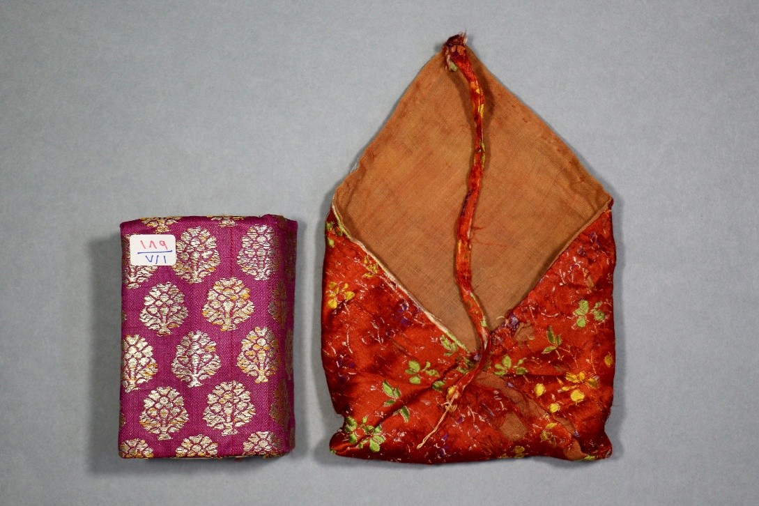 Manuscript bag shown open alongside the enclosed manuscript, illustrating the relationship between the textile enclosure and its contents